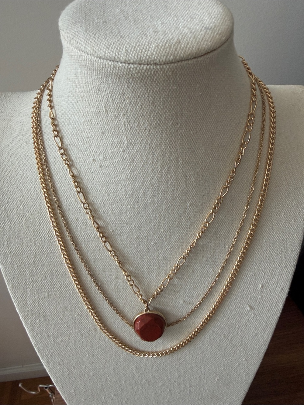 Multi Strand Gold Tone Layered Necklace with Round Red Jasper Stone Pendant.